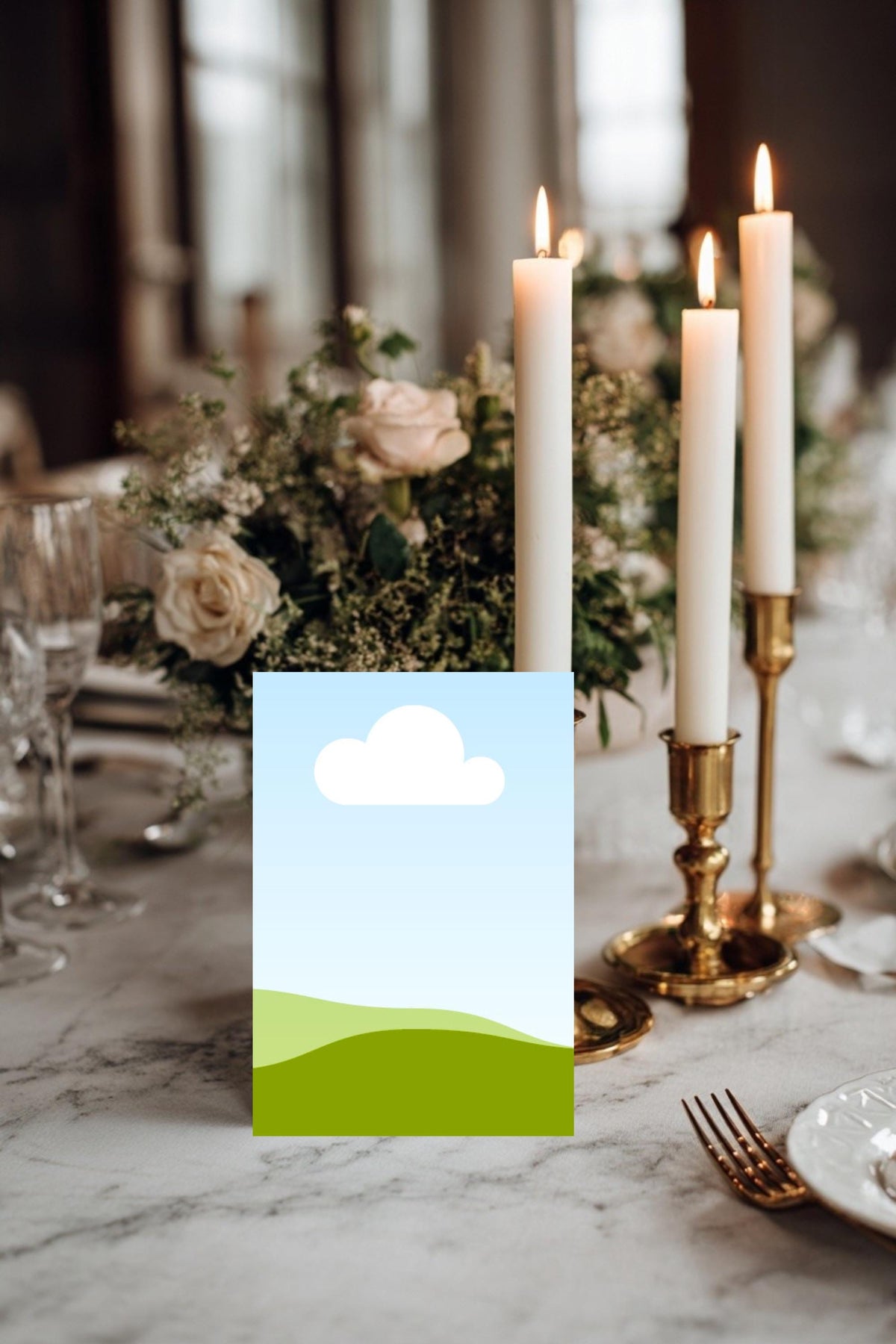 Wedding place card mockup with blue-sky top, green hills, and white cloud icon