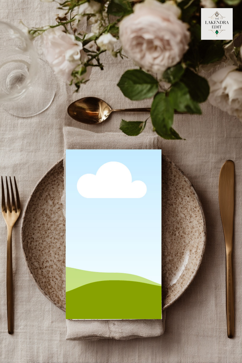 Wedding invitation card mockup with blue sky, white cloud, and green hills design on table