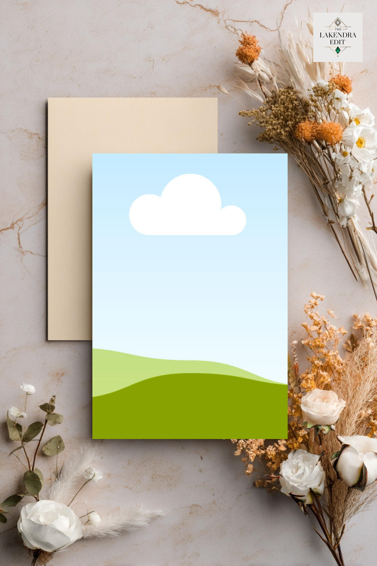 Wedding invitation card mockup with blue sky, white cloud, and green hills design overlaid