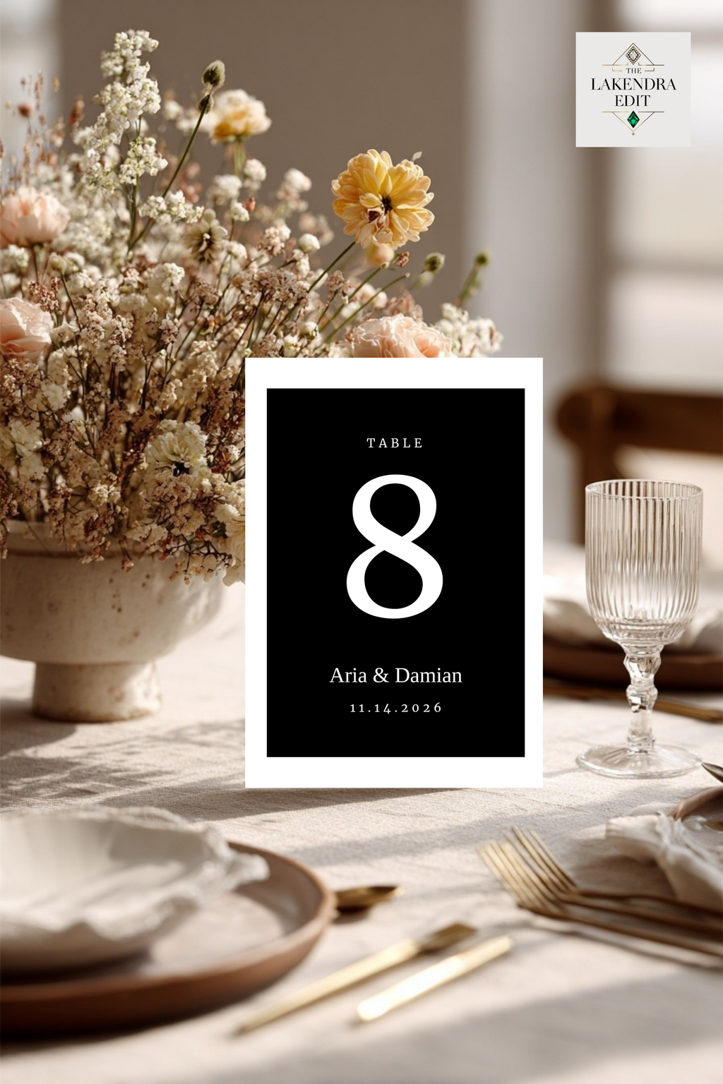 Black table number card showing large "8" with "Aria & Damian" beneath