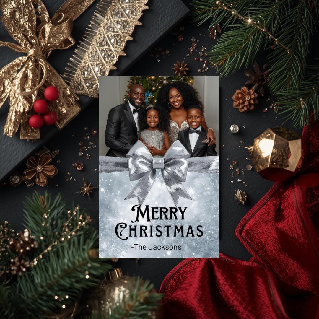 Christmas card template showing family portrait with silver bow over snowy blue “Merry Christmas”