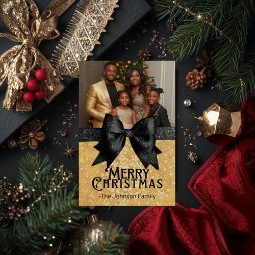 Black and gold Christmas photo card with oversized glitter black bow and family line